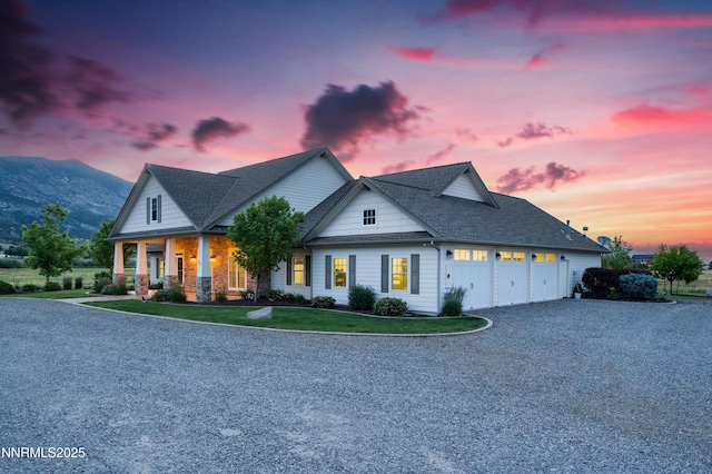600 Artemesia Ln, Gardnerville, NV 89460 - view of front of home with an attached garage, gravel driveway, covered porch, and a shingled roof