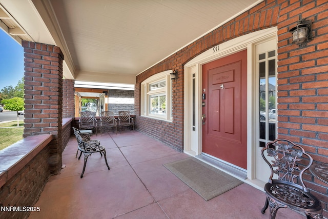 911 F St, Sparks, NV 89431 - property entrance featuring covered porch and brick siding