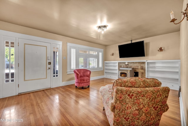 911 F St, Sparks, NV 89431 - living area featuring wood finished floors and a brick fireplace