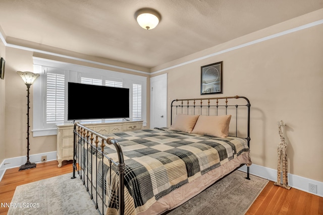 911 F St, Sparks, NV 89431 - bedroom featuring wood finished floors and crown molding