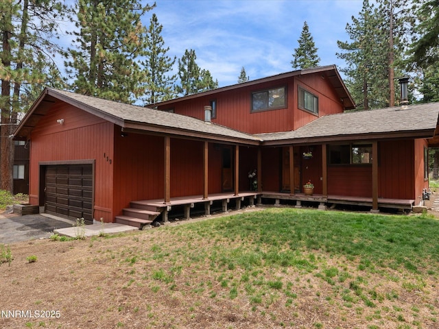 139 Rosewood Cir, Stateline, NV 89449 - view of front of home with a front yard, driveway, a garage, and roof with shingles