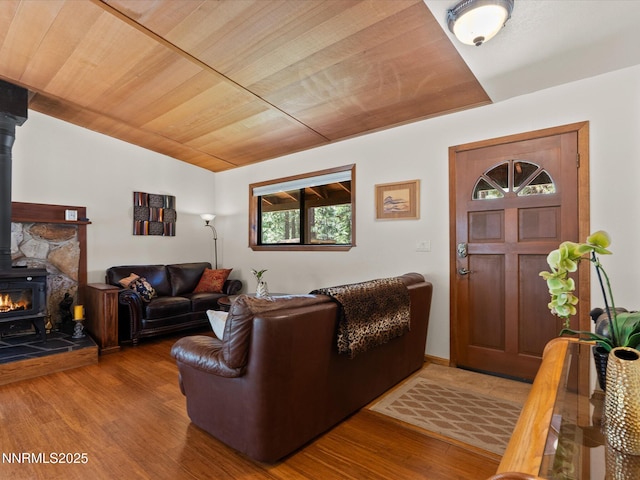 139 Rosewood Cir, Stateline, NV 89449 - living room with a wood stove, wood finished floors, vaulted ceiling, and wood ceiling