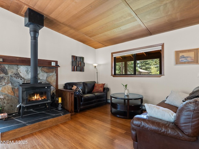 139 Rosewood Cir, Stateline, NV 89449 - living area with vaulted ceiling, a wood stove, wood ceiling, and wood finished floors