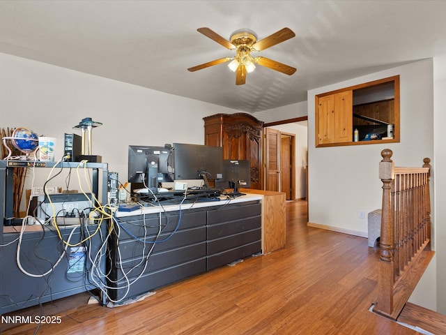 139 Rosewood Cir, Stateline, NV 89449 - kitchen featuring tile countertops, light wood-style flooring, a ceiling fan, and a desk