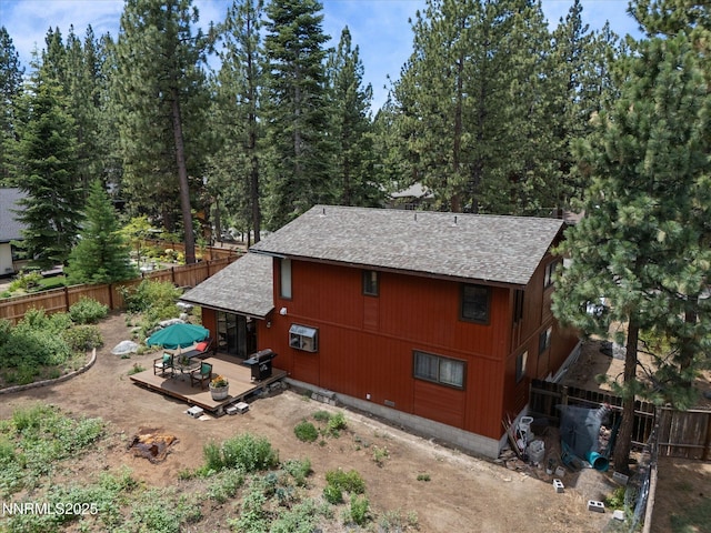 139 Rosewood Cir, Stateline, NV 89449 - view of home's exterior featuring a shingled roof, a deck, and a fenced backyard