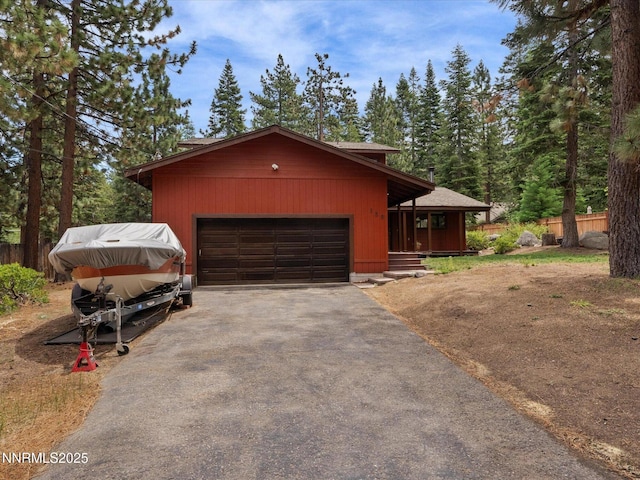 139 Rosewood Cir, Stateline, NV 89449 - view of front of house with driveway, an attached garage, and covered porch