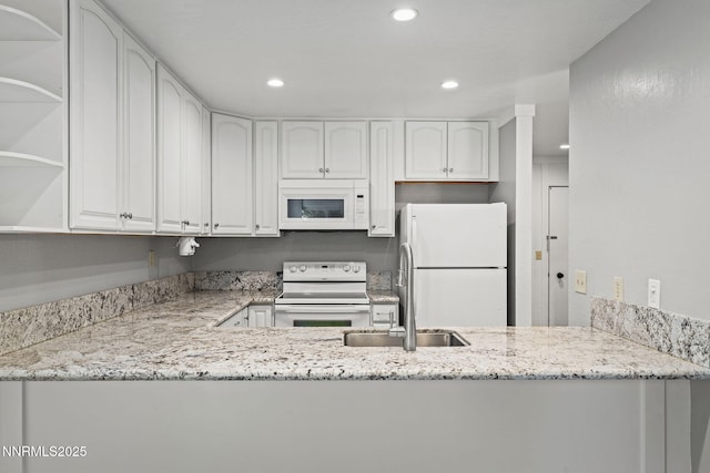 807 Alder Ave Unit 14, Incline Village, NV 89451 - kitchen with white appliances, light stone countertops, recessed lighting, white cabinets, and open shelves