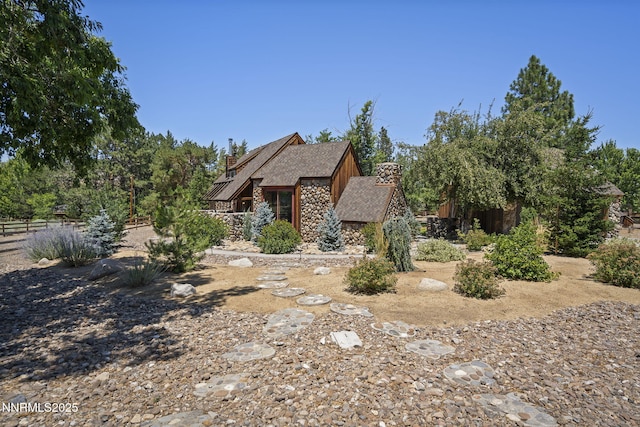 4275 Juniper Creek Rd, Reno, NV 89519 - view of front facade featuring stone siding and a chimney