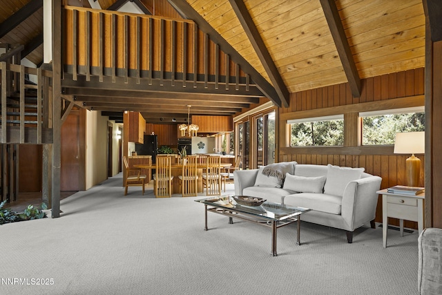 4275 Juniper Creek Rd, Reno, NV 89519 - carpeted living room with a wood ceiling with exposed beams, high vaulted ceiling, a chandelier, and wooden walls