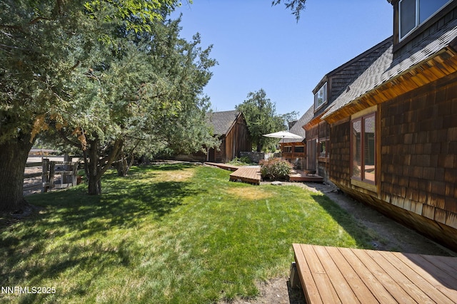 4275 Juniper Creek Rd, Reno, NV 89519 - view of yard with a wooden deck and an outbuilding