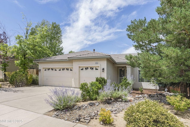 4833 Ramcreek Trl, Reno, NV 89519 - single story home with a tile roof, a garage, concrete driveway, and stucco siding