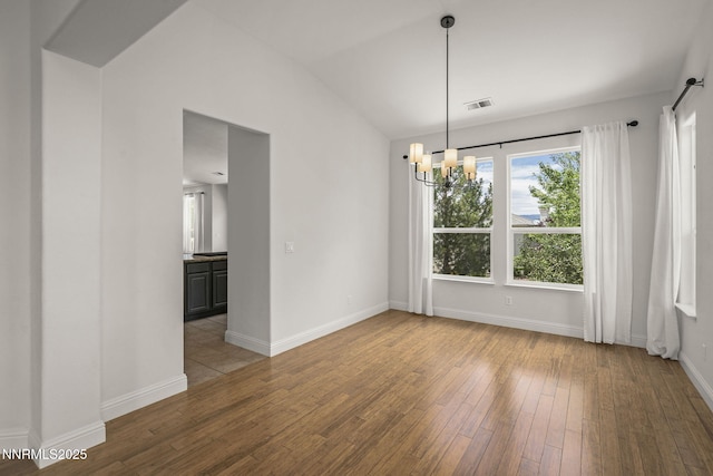 4833 Ramcreek Trl, Reno, NV 89519 - unfurnished dining area with a chandelier, hardwood / wood-style floors, and vaulted ceiling