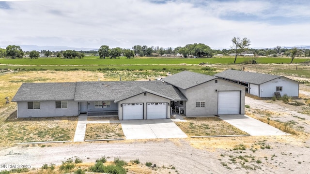 4625 Schurz Hwy, Fallon, NV 89406 - ranch-style home featuring a garage, driveway, and stucco siding