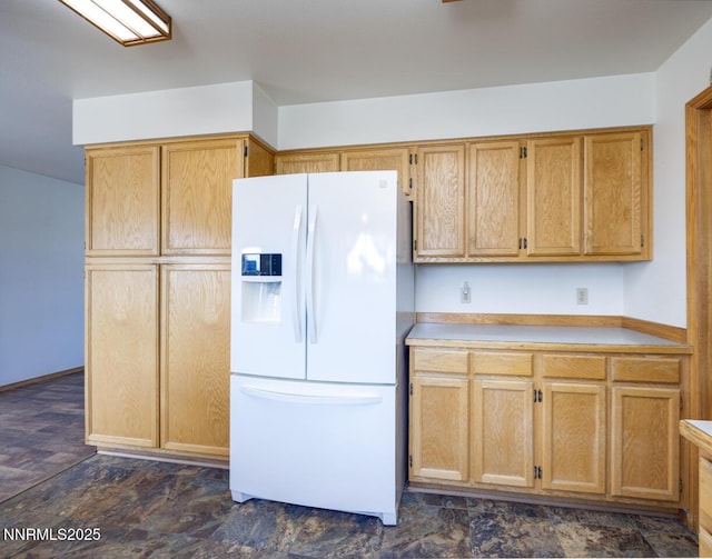 4625 Schurz Hwy, Fallon, NV 89406 - kitchen with white fridge with ice dispenser and light countertops