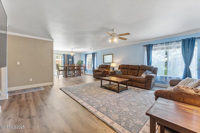 18324 Dustin Ct, Reno, NV 89508 - living area featuring a ceiling fan, wood finished floors, and ornamental molding
