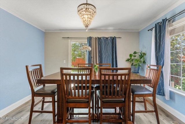 18324 Dustin Ct, Reno, NV 89508 - dining room featuring wood finished floors, healthy amount of natural light, ornamental molding, and a chandelier