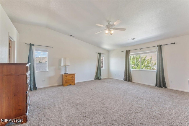 18324 Dustin Ct, Reno, NV 89508 - unfurnished bedroom featuring lofted ceiling, light carpet, and a ceiling fan