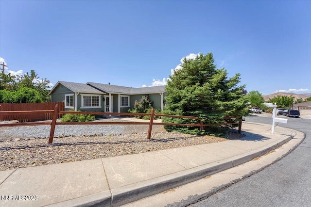 5476 Cabin Ct, Sun Valley, NV 89433 - single story home with a fenced front yard
