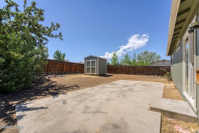5476 Cabin Ct, Sun Valley, NV 89433 - fenced backyard with a patio and a storage unit