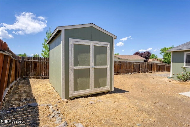 5476 Cabin Ct, Sun Valley, NV 89433 - view of shed with a fenced backyard
