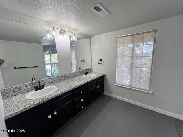 6845 Forsythia Way, Reno, NV 89506 - full bath featuring double vanity and a textured ceiling