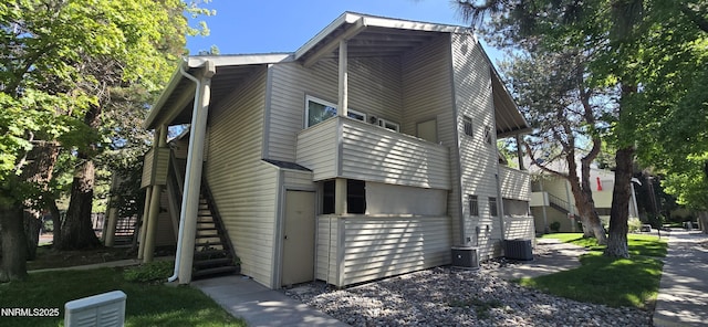 2111 Roundhouse Rd, Sparks, NV 89431 - view of property exterior featuring stairway and a central air condition unit