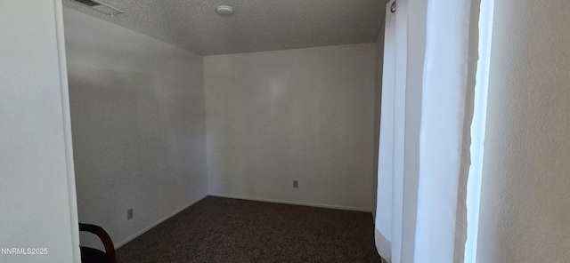 2111 Roundhouse Rd, Sparks, NV 89431 - unfurnished room featuring dark carpet and a textured ceiling