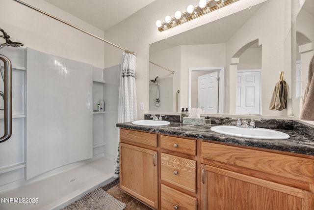 6230 Ingleston Dr Unit 212, Sparks, NV 89436 - bathroom featuring a shower with curtain, double vanity, and tile patterned flooring