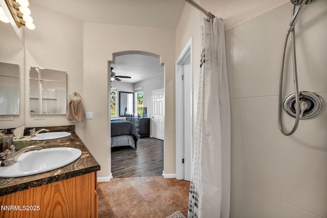 6230 Ingleston Dr Unit 212, Sparks, NV 89436 - ensuite bathroom featuring ceiling fan, double vanity, and curtained shower
