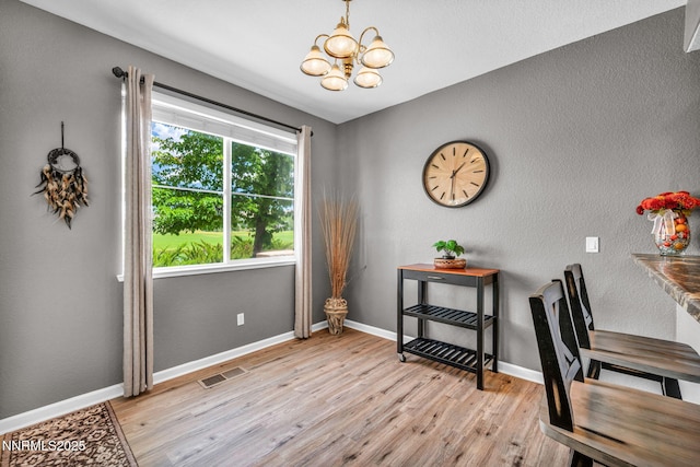 6230 Ingleston Dr Unit 212, Sparks, NV 89436 - office space featuring a chandelier, light wood finished floors, and a textured wall