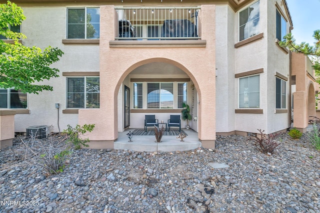 6230 Ingleston Dr Unit 212, Sparks, NV 89436 - rear view of house featuring a balcony, stucco siding, and a porch