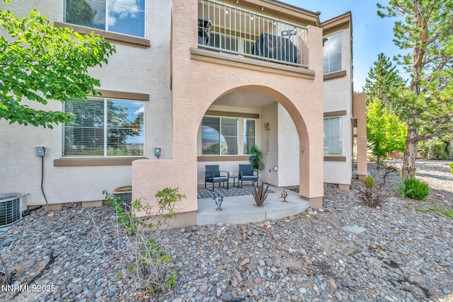 6230 Ingleston Dr Unit 212, Sparks, NV 89436 - doorway to property featuring stucco siding, a balcony, and covered porch