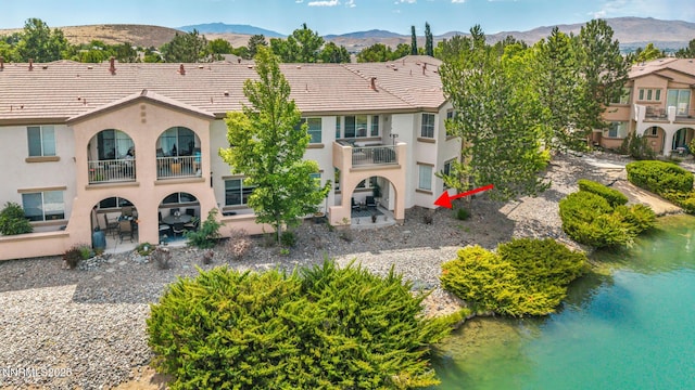 6230 Ingleston Dr Unit 212, Sparks, NV 89436 - rear view of property with a balcony, a patio area, and a mountain view