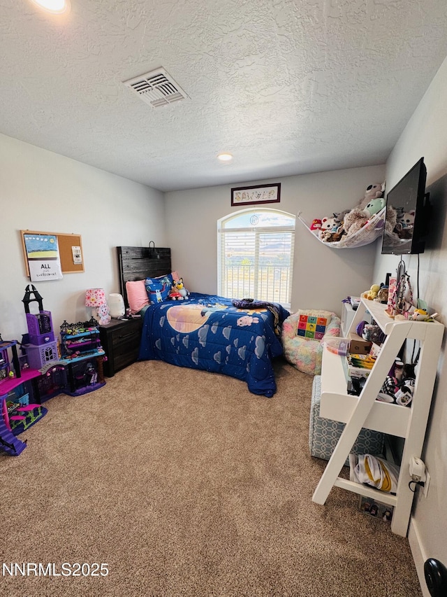 5290 Marla Dr, Winnemucca, NV 89445 - carpeted bedroom featuring a textured ceiling