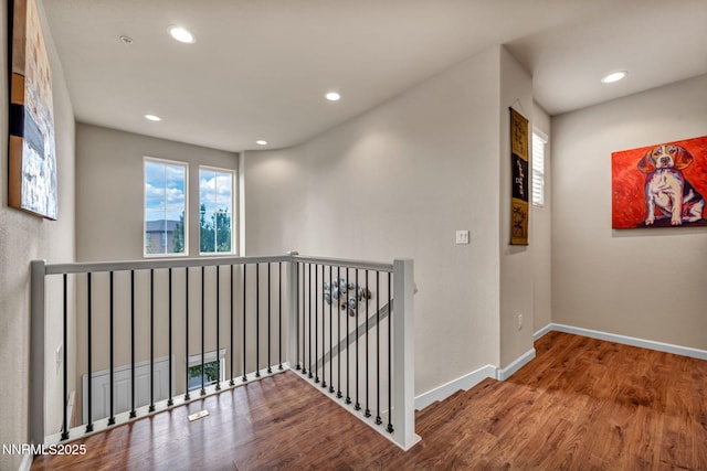 6775 Russian Thistle Dr, Sparks, NV 89436 - hall featuring an upstairs landing, recessed lighting, and wood finished floors