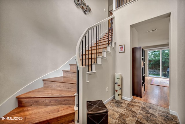 6775 Russian Thistle Dr, Sparks, NV 89436 - stairway featuring baseboards and stone finish flooring