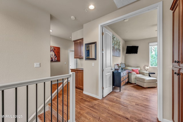 6775 Russian Thistle Dr, Sparks, NV 89436 - hall with light wood-style floors, an upstairs landing, and recessed lighting