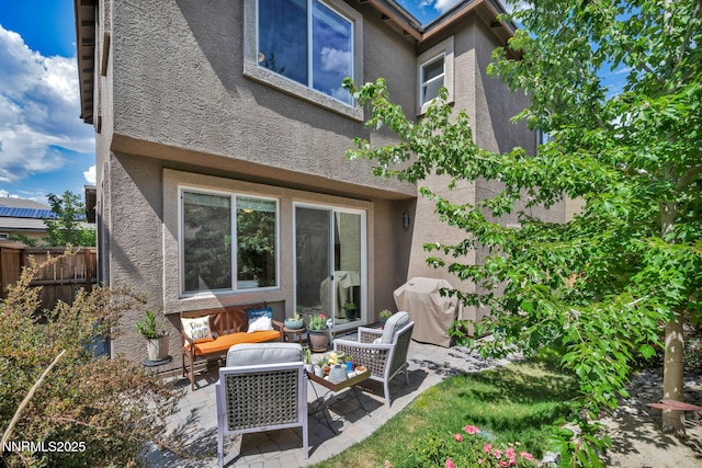 6775 Russian Thistle Dr, Sparks, NV 89436 - back of property featuring stucco siding, outdoor lounge area, and a patio area