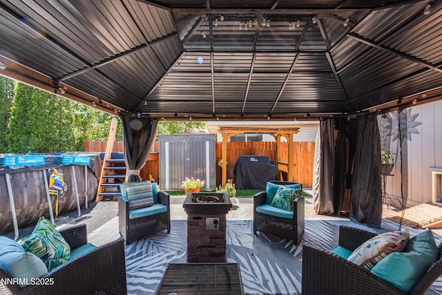 4130 Snowshoe Ln, Reno, NV 89502 - view of patio with a gazebo, an outdoor living space with a fire pit, and grilling area