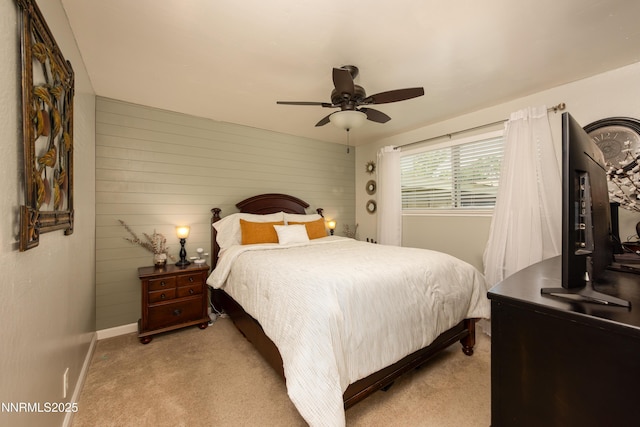 4130 Snowshoe Ln, Reno, NV 89502 - bedroom with carpet flooring, wood walls, and a ceiling fan