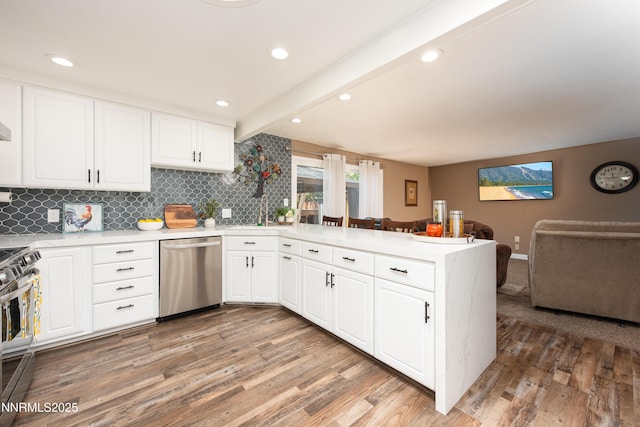 4130 Snowshoe Ln, Reno, NV 89502 - kitchen with stainless steel appliances, light wood finished floors, a peninsula, light countertops, and recessed lighting