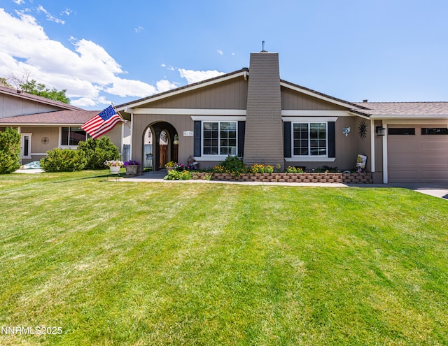 4130 Snowshoe Ln, Reno, NV 89502 - view of front of house with an attached garage, a chimney, a front yard, and concrete driveway