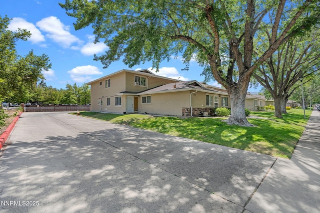940 Jamaica Ave Unit 3, Reno, NV 89502 - view of front of home with stucco siding and driveway