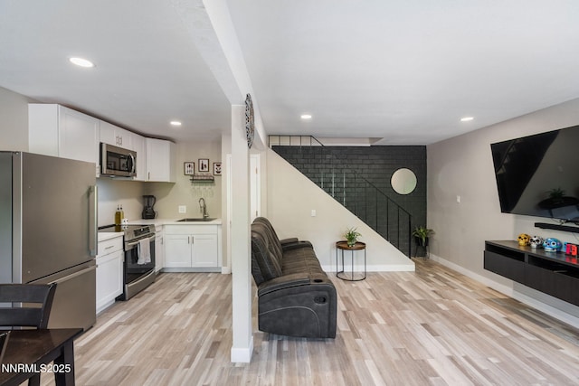 940 Jamaica Ave Unit 3, Reno, NV 89502 - living area with stairs, light wood-type flooring, and recessed lighting