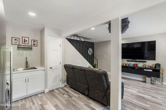 940 Jamaica Ave Unit 3, Reno, NV 89502 - living area with light wood-style flooring, stairway, and recessed lighting