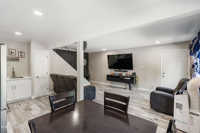 940 Jamaica Ave Unit 3, Reno, NV 89502 - living room featuring light wood-style flooring, stairs, and recessed lighting