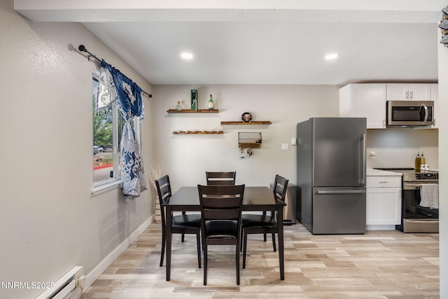 940 Jamaica Ave Unit 3, Reno, NV 89502 - dining area featuring light wood-style floors, baseboard heating, and recessed lighting