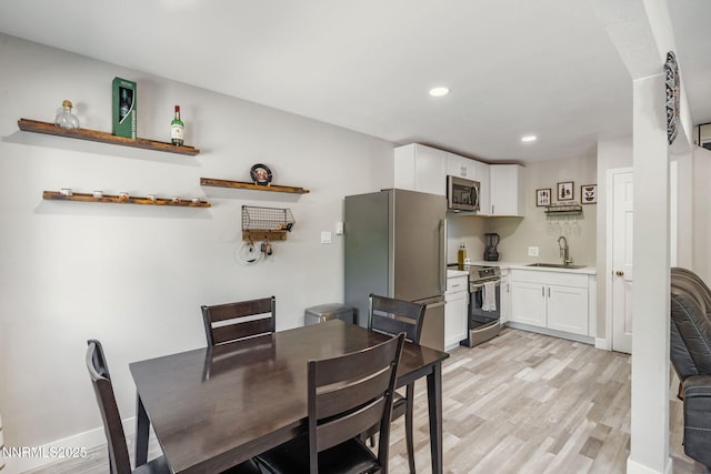 940 Jamaica Ave Unit 3, Reno, NV 89502 - dining room featuring light wood-style flooring and recessed lighting