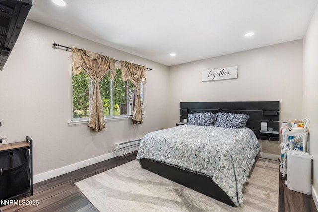 940 Jamaica Ave Unit 3, Reno, NV 89502 - bedroom with a baseboard heating unit, wood finished floors, and recessed lighting
