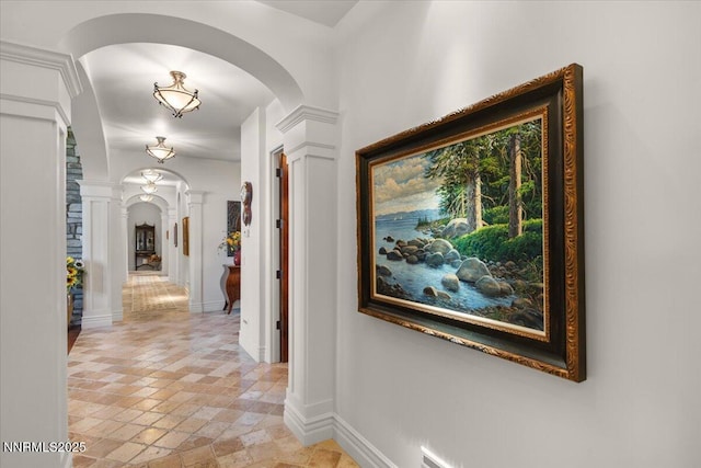 1555 Boulder Field Way, Reno, NV 89511 - hallway with decorative columns, arched walkways, and stone tile floors